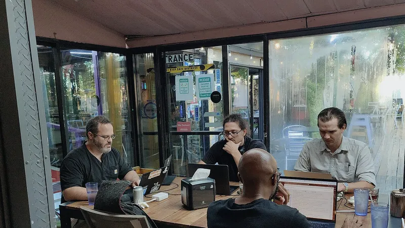 People working at laptops in a Dallas coworking space