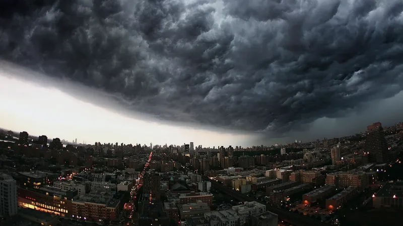 Dark storm clouds rolling over a city at dusk