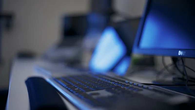 New black desktop tower and monitor on a wooden desk